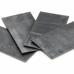 Overlapping lead sheets for radiation shielding on a white background.