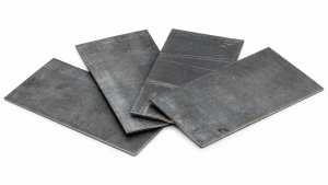 Overlapping lead sheets for radiation shielding on a white background.